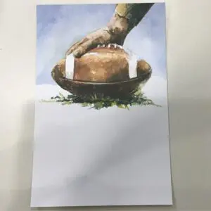 Hand Holding Football On Ground (Stationery)